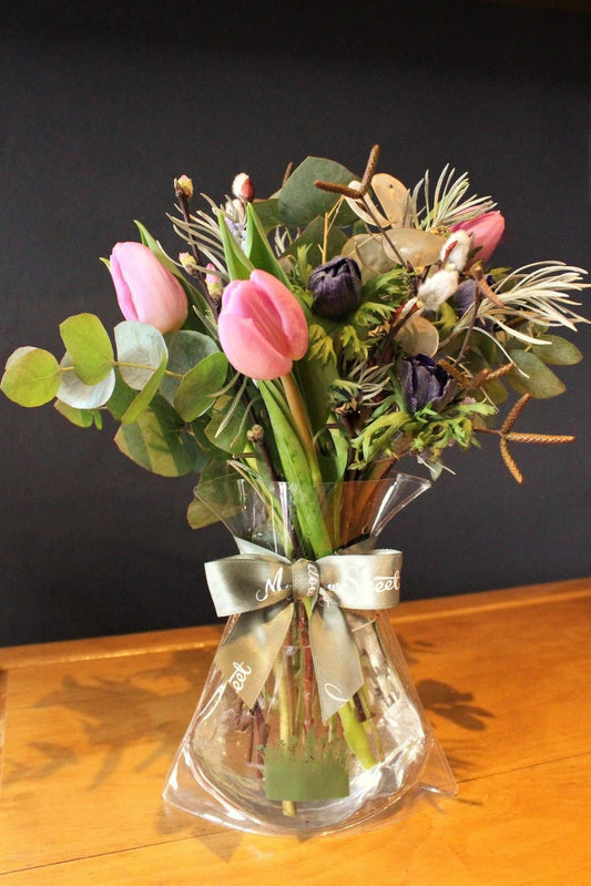 MeadowSweet seasonal posy with Pink tulips, blue anemones, silver eucalyptus, pussy willow, birch catkins and curry plant. 