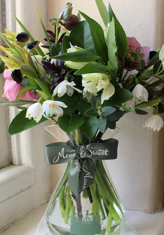 MeadowSweet seasonal February posy with Snowflakes, green iris, alstromeria, hellebores, chosia, bay, pussy willow, eucalyptus.