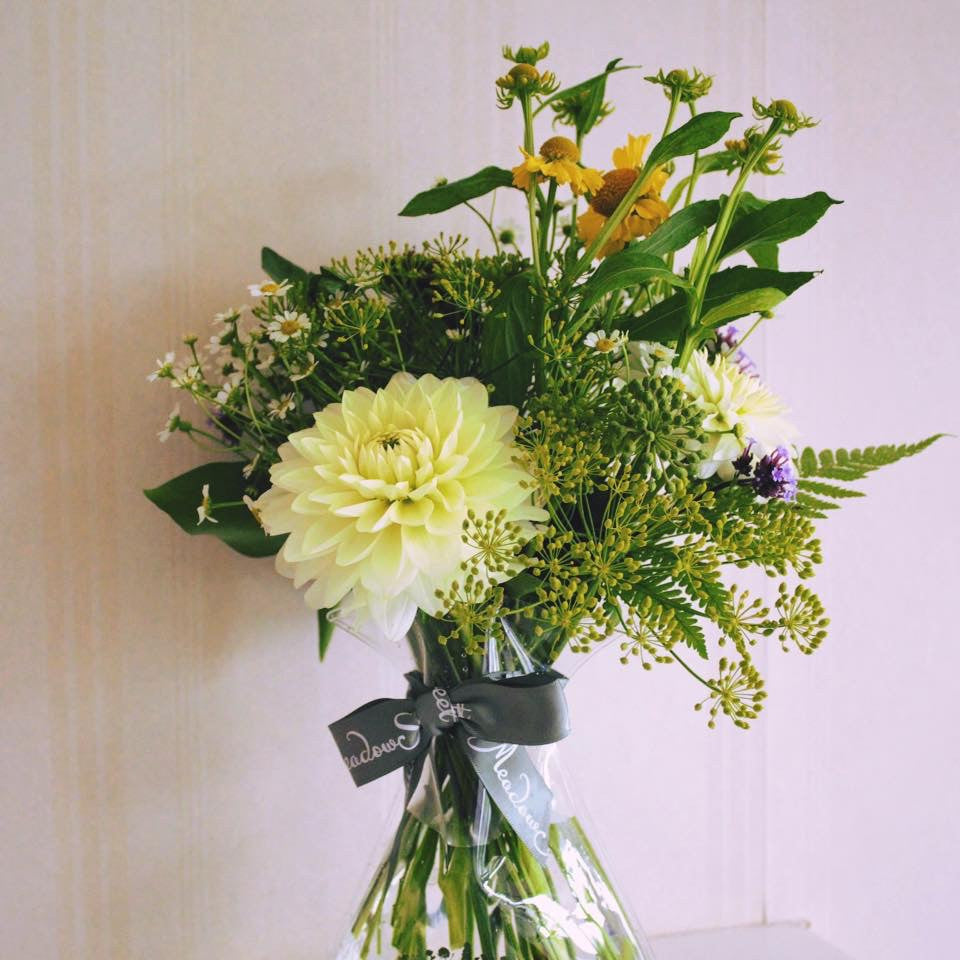 MeadowSweet seasonal posy with British dahlias with helenium, feverfew, fennel, ivy berries and ferns.