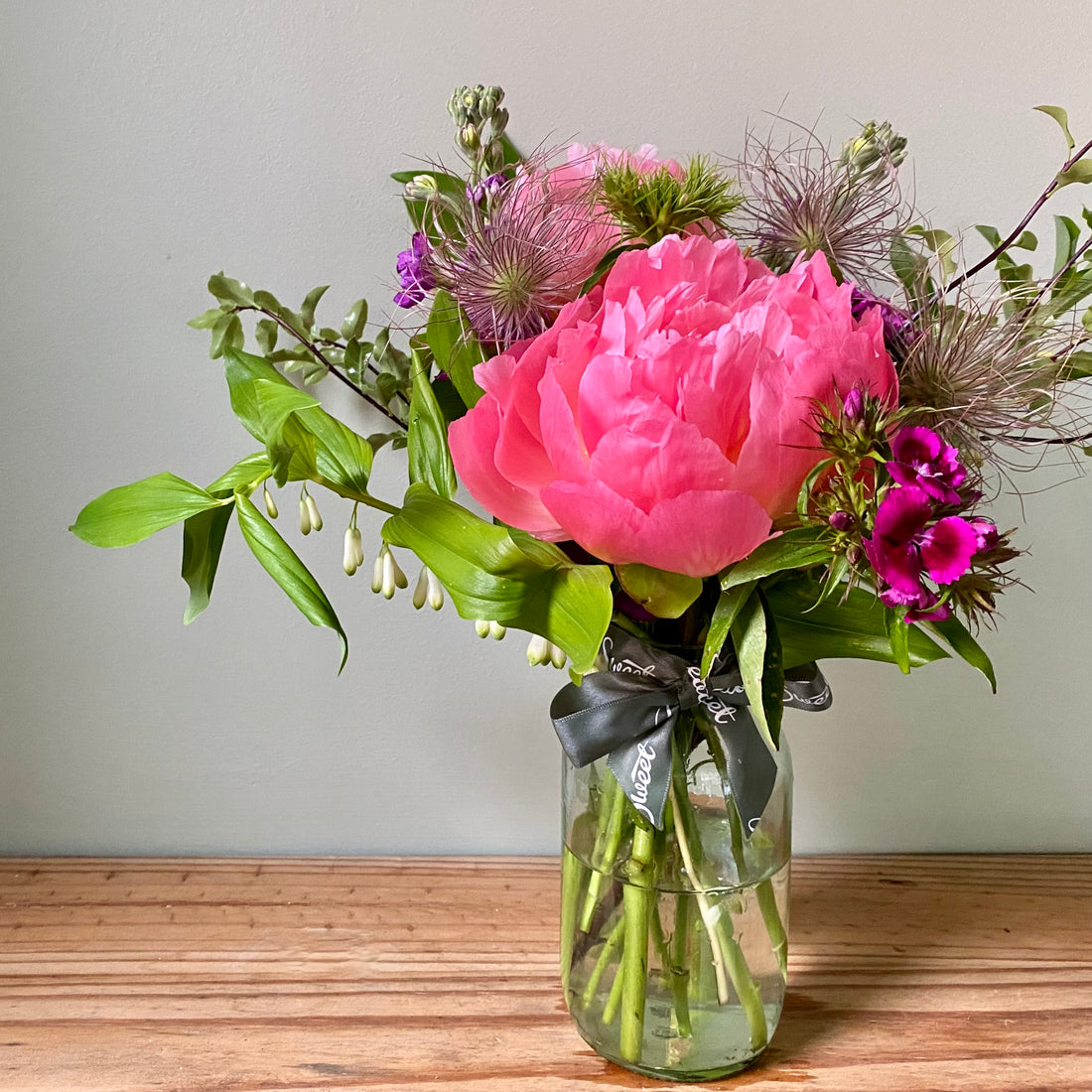 Beautifully-arranged British peonies and other British seasonal flowers