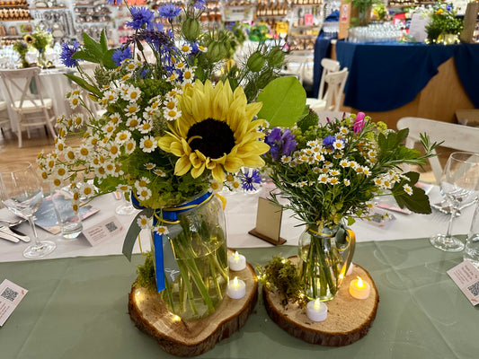 British summer sunflowers table decorations in glass jars