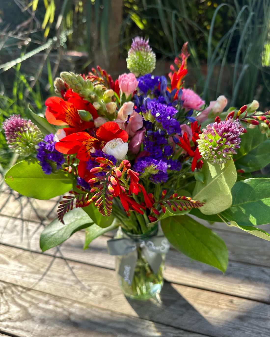 Pretty British summertime flowers in a glass jar
