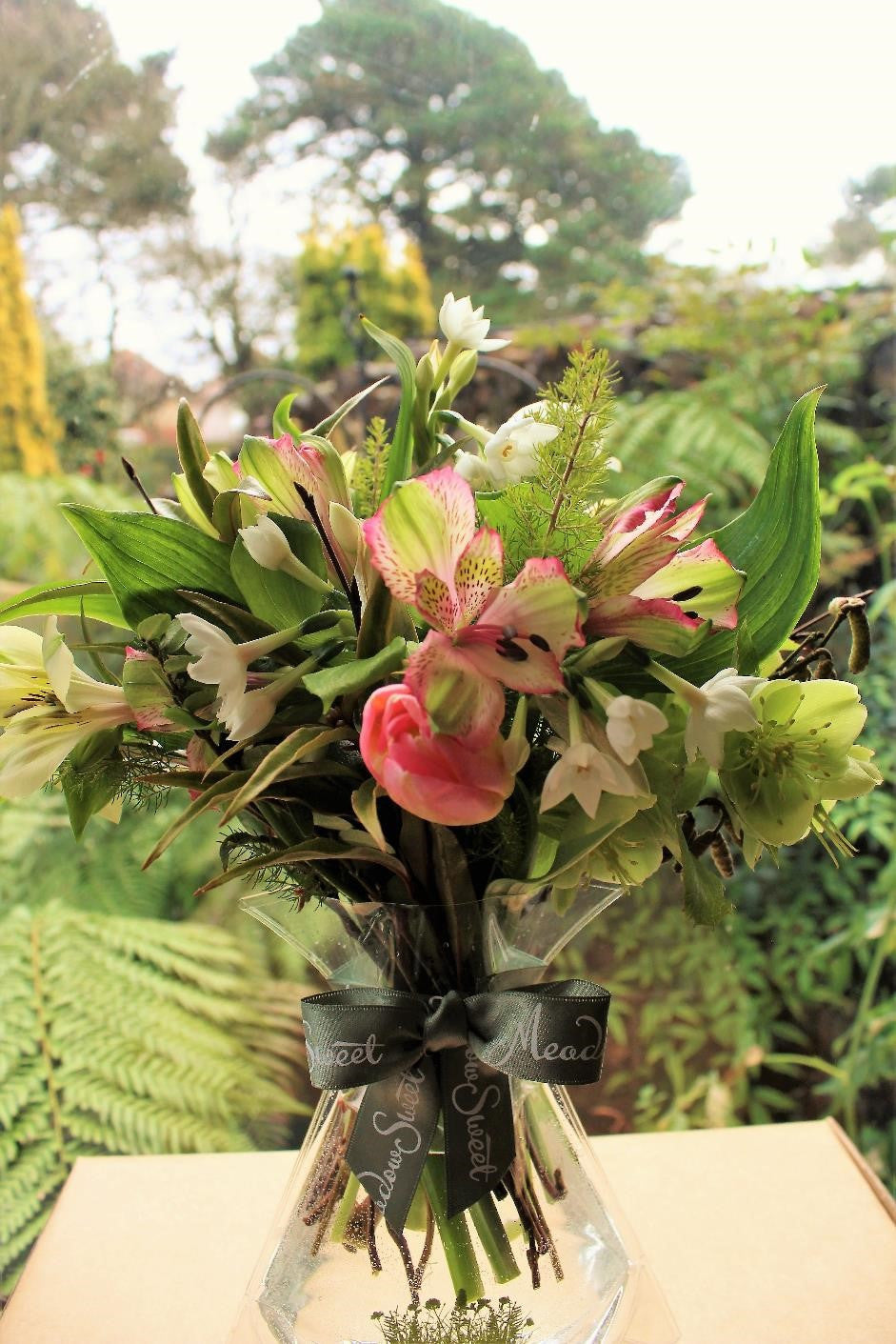 MeadowSweet seasonal posy with Alstromeria, Ranunculus,Tulips, Paperwhites, Tree Heather, Birch, Hazel, Stinking Hellebores.