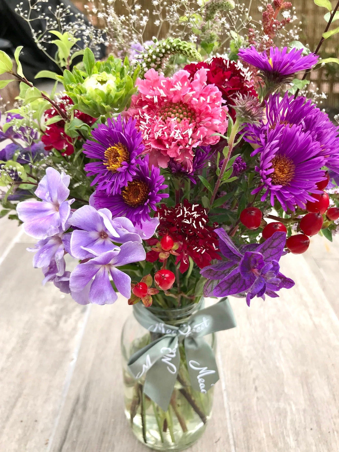 Bright and cheery homegrown and British grown asters, phlox and scabious