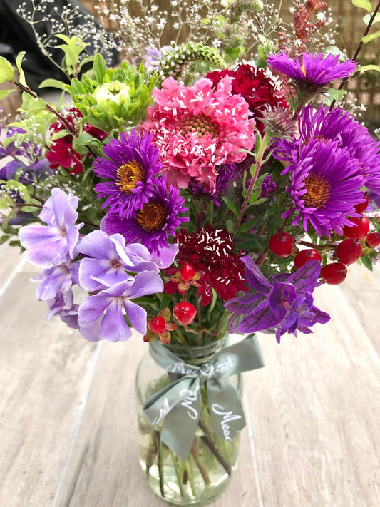 Bright and cheery homegrown and British grown asters, phlox and scabious