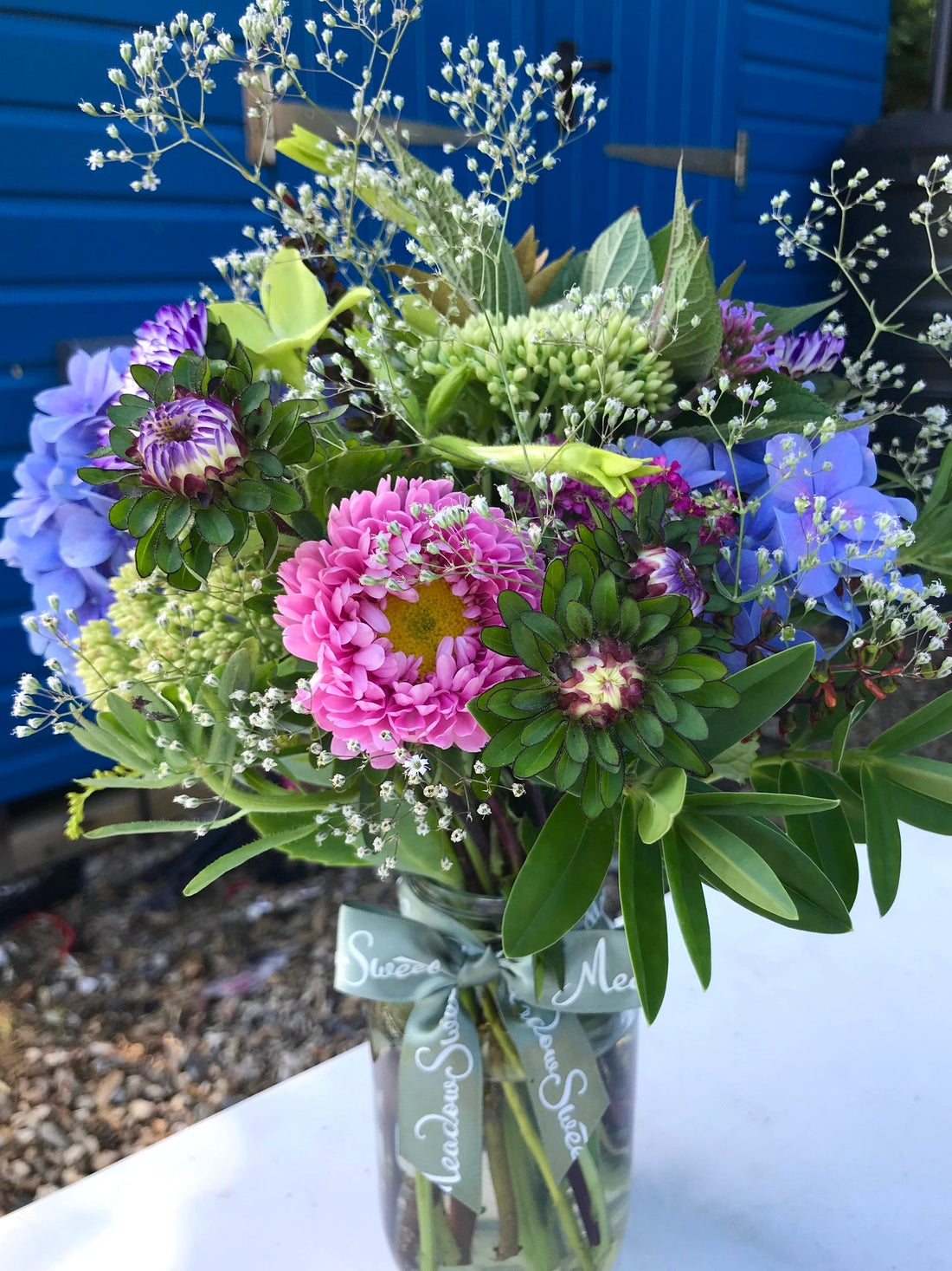 British and homegrown pretty summer flowers in a jar