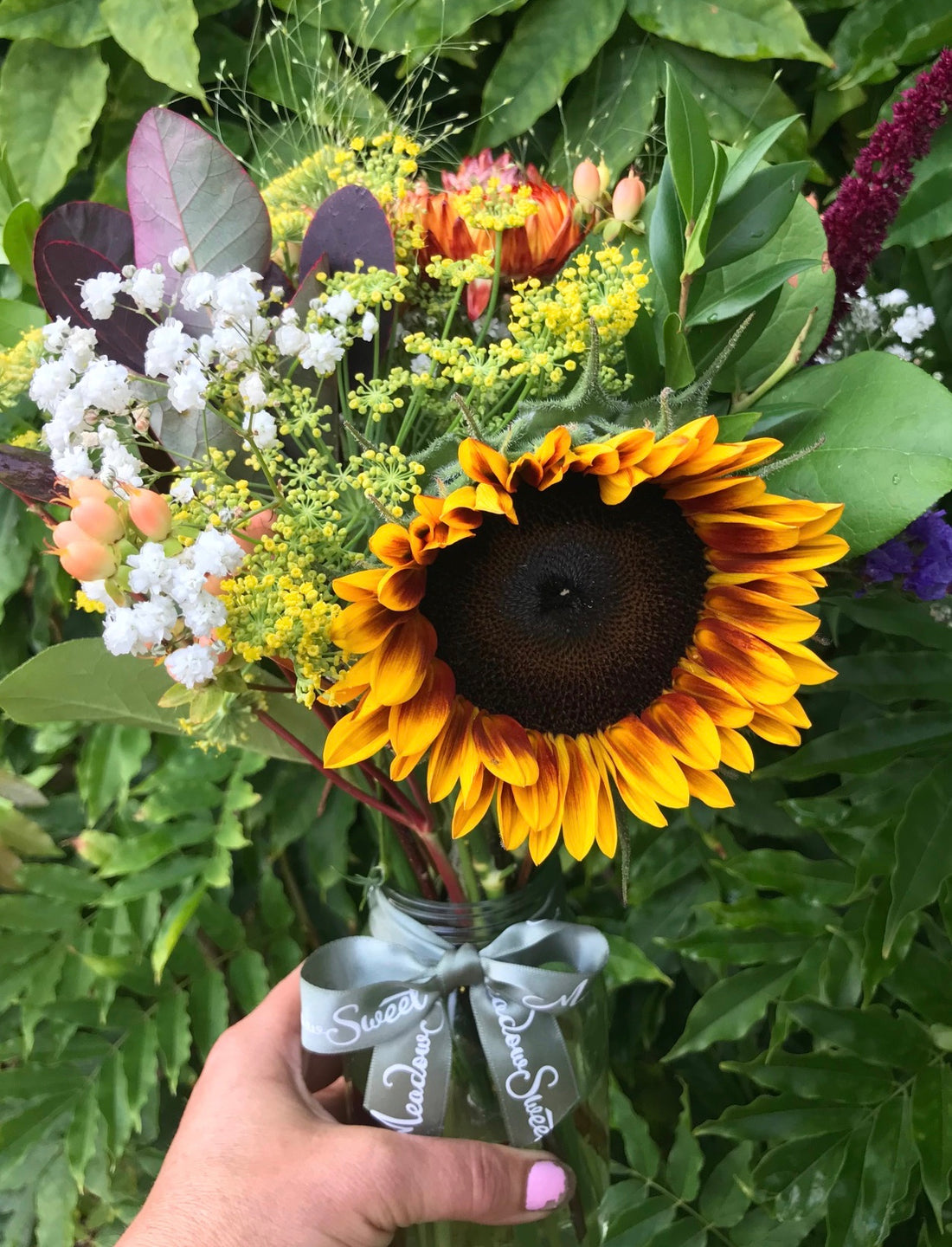 Rusty sunflowers with helichrysum, limonium and homegrown gypsophila.