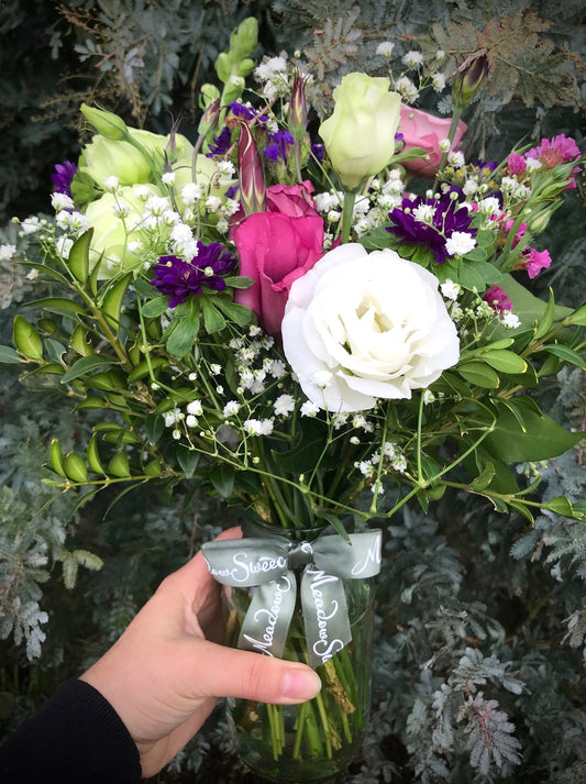 British, seasonal flower posy featuring lisianthus and gypsophila