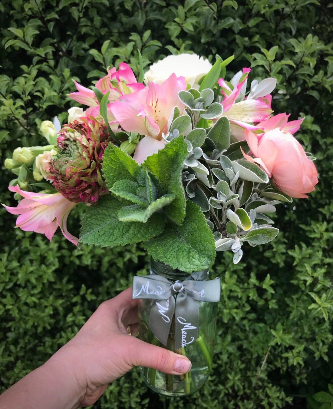 British Spring flowers including ranunculus in subscription posy