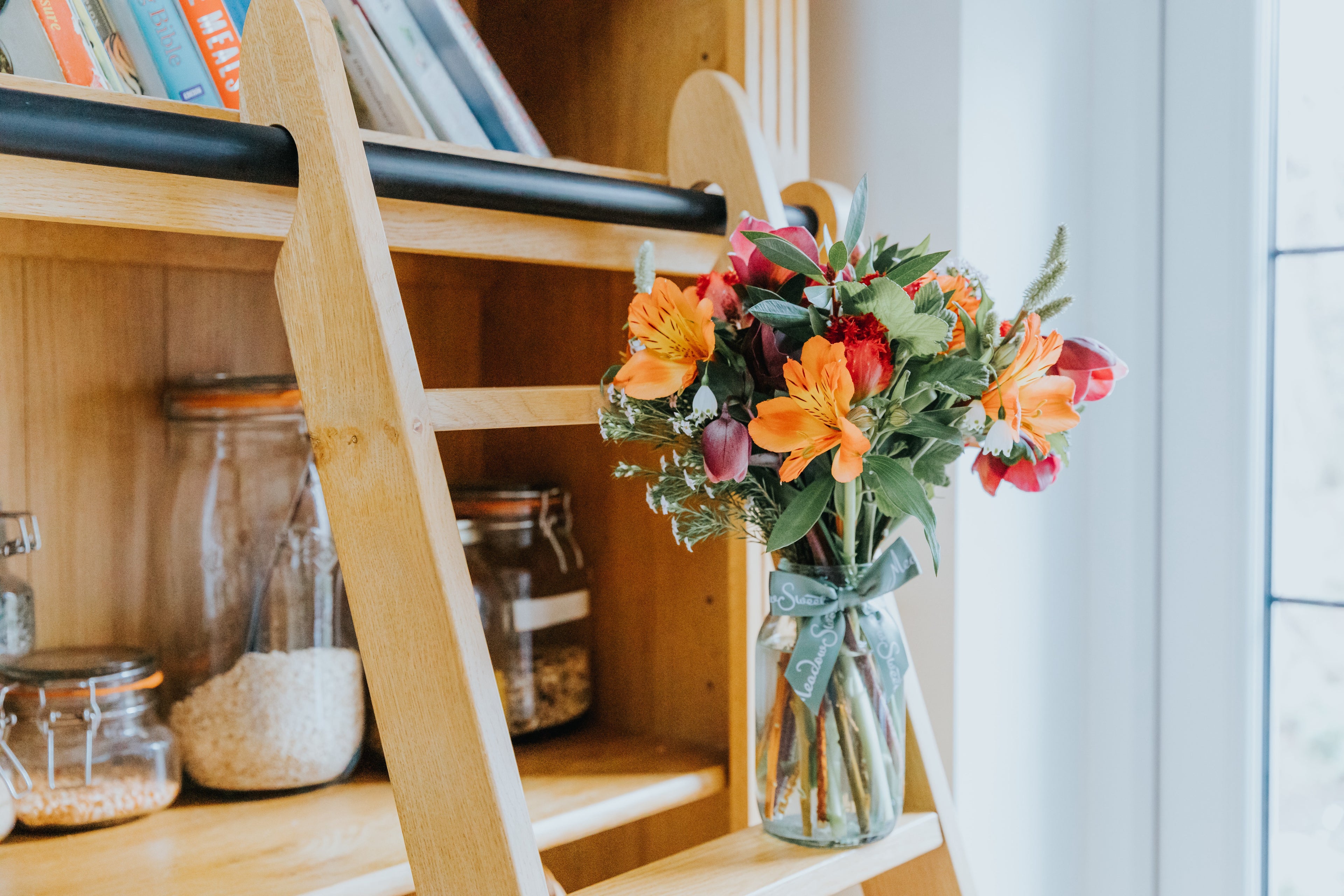 Bouquet of British grown flowers in a glass jar