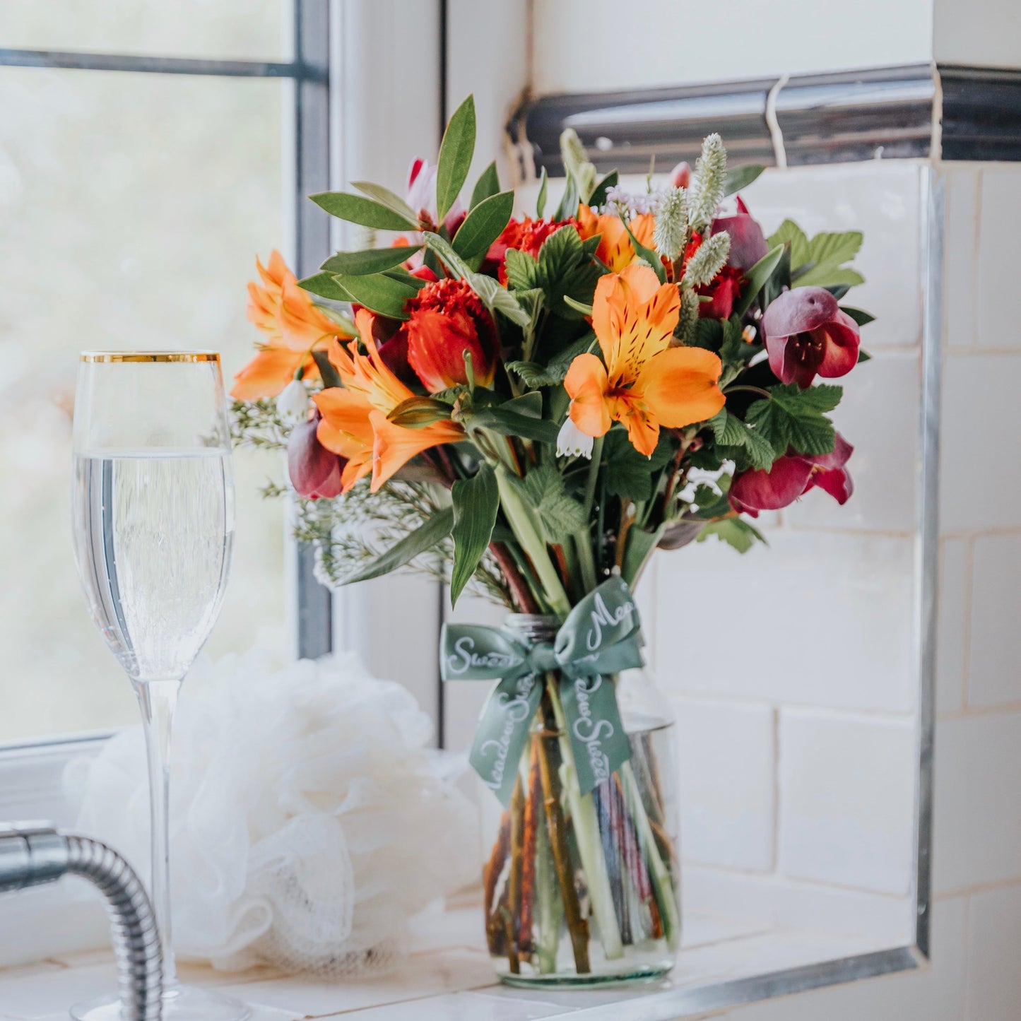 British seasonal flower posy featuring winter flowers, tulips, alstroemeria and hellibores. A MeadowSweet weekly flower subscription service in a jar with free UK delivery.